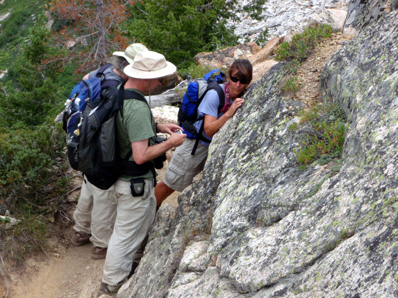 Rick, Nola and Juli inspect the rock