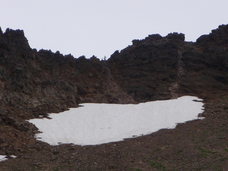 Snow patch from below. Route is 5 ft wide dike above right side of snow