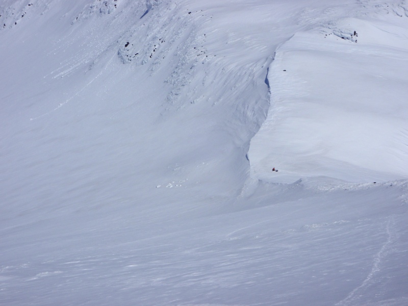 Looking back down the north ridge, skier is already back to the saddle